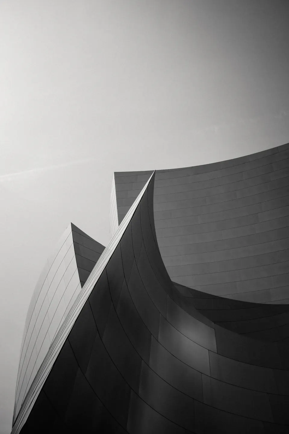Curved architectural forms rising into the sky